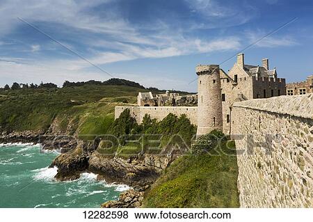 Old stone walled fort on hillside with turret on rocky shoreline along the sea with blue sky and clouds; Plevenon, Brittany, France View Large Photo Image Stock Photo - Old stone walled fort on hillside with turret on rocky shoreline along the sea with blue sky and clouds; Plevenon, Brittany, France. Fotosearch