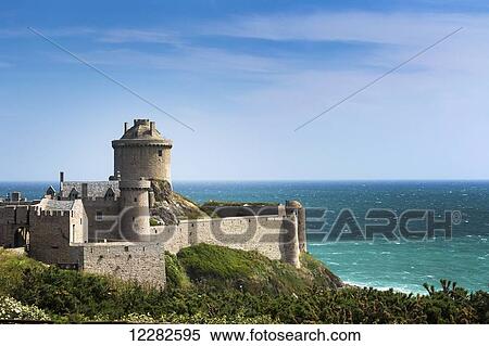 Old stone walled fort with turret on hillside overlooking the sea with blue sky and clouds; Plevenon, Brittany, France View Large Photo Image Stock Photography - Old stone walled fort with turret on hillside overlooking the sea with blue sky and clouds; Plevenon, Brittany, France. Fotosearch