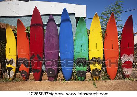 Stock Photograph - Old windsurf boards in a row as a fence; Paia, Maui, Hawaii, United States of America. Fotosearch