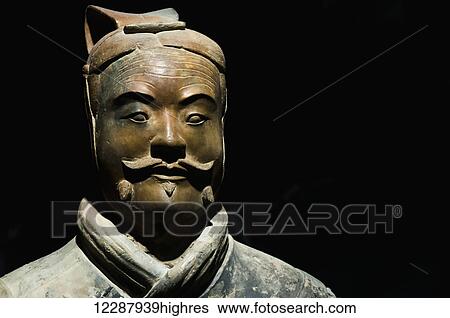 Stock Photograph - One of Xians Terracota Warriors, a collection of terracotta sculptures depicting the armies of Qin Shi Huang, the first Emperor of China; Xian, Shaanxi province, China. Fotosearch