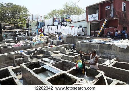 Stock Image - Open air laundromat; Mumbai, India. Fotosearch