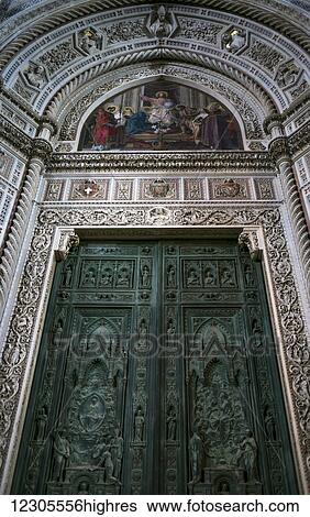 Stock Photograph - Ornate green door and artwork on Florence Cathedral; Florence, Italy. Fotosearch