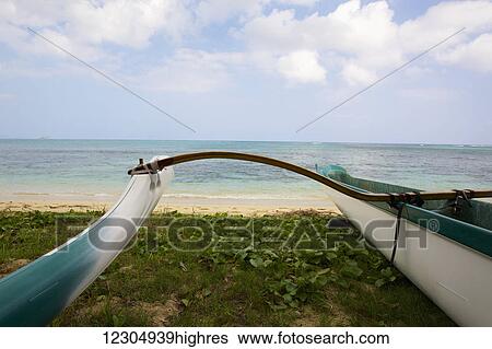 Stock Photograph - Outrigger canoe on Waimanalo Beach; Waimanalo, Oahu, Hawaii, United States of America. Fotosearch