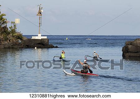 Outrigger canoes heading out of Honokohau Harbor, Kona coast; Kona, Island of Hawaii, Hawaii, United States of America View Large Photo Image Stock Photograph - Outrigger canoes heading out of Honokohau Harbor, Kona coast; Kona, Island of Hawaii, Hawaii, United States of America. Fotosearch