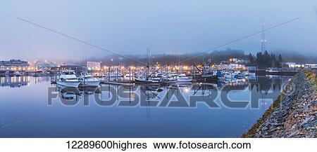 Panorama of boats in Ketchikan Harbor reflecting on the calm ocean waters on a foggy night, Ketchikan, Southeast Alaska View Large Photo Image Stock Photograph - Panorama of boats in Ketchikan Harbor reflecting on the calm ocean waters on a foggy night, Ketchikan, Southeast Alaska. Fotosearch