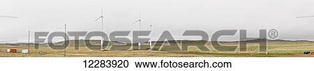 Stock Image - Panorama of wind turbines on green tundra, St. Paul Island, Southwestern Alaska, USA, Summer. Fotosearch
