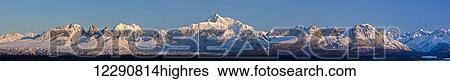 Stock Photograph - Panoramic view of sunrise over Denali and the Alaska Range, Denali State Park, Southcentral Alaska, Winter. Fotosearch