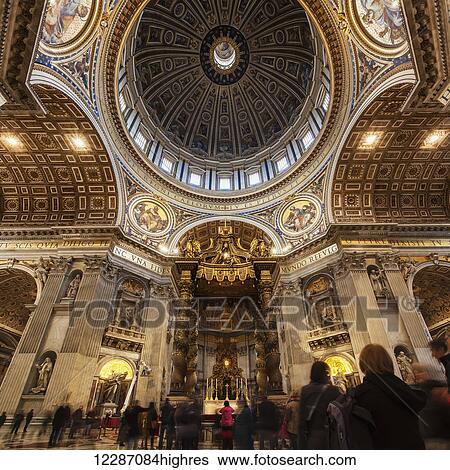 Stock Photograph - Papal altar and tourists, St. Peter's Basilica; Rome, Italy. Fotosearch