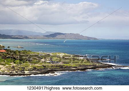 Stock Photograph - Paraglider and view from Makapuu Point; Oahu, Hawaii, United States of America. Fotosearch