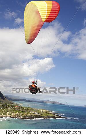 Stock Photograph - Paraglider at Makapu'u Point; Oahu, Hawaii, United States of America. Fotosearch