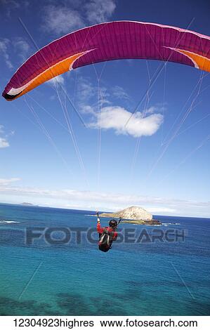 Stock Photograph - Paraglider at Makapuu Point; Oahu, Hawaii, United States of America. Fotosearch