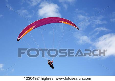 Stock Photograph - Paraglider at Makapuu Point; Oahu, Hawaii, United States of America. Fotosearch