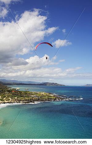 Stock Photograph - Paraglider at Makapuu Point; Oahu, Hawaii, United States of America. Fotosearch