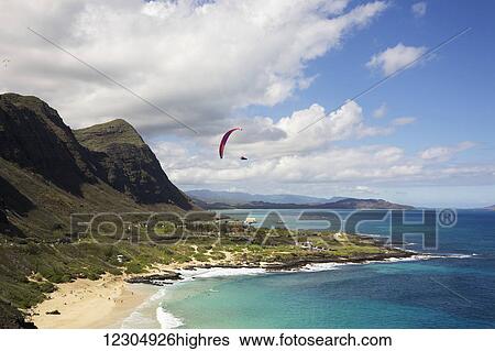 Stock Photograph - Paraglider at Makapuu Point; Oahu, Hawaii, United States of America. Fotosearch