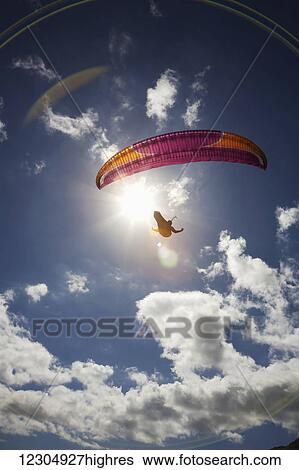 Stock Photograph - Paraglider at Makapuu Point; Oahu, Hawaii, United States of America. Fotosearch