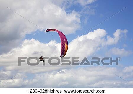 Stock Photograph - Paragliding at Makapuu Point; Oahu, Hawaii, United States of America. Fotosearch