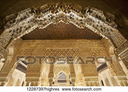 Stock Photograph - Patio of the Lions at the Nasrid Palace in the Alhambra Palace; Granada, Spain. Fotosearch