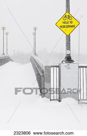 Pedestrian walkway/bikepath on a snowy day; Winnipeg, Manitoba, Canada View Large Photo Image Stock Photograph - Pedestrian walkway/bikepath on a snowy day; Winnipeg, Manitoba, Canada. Fotosearch