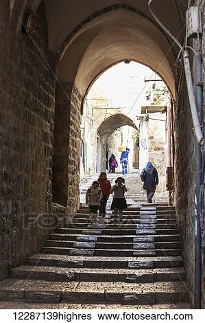 Pedestrians on a walkway in the old city; Jerusalem, Israel View Large Photo Image Stock Photograph - Pedestrians on a walkway in the old city; Jerusalem, Israel. Fotosearch