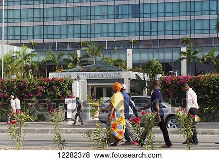 Pedestrians walking along a street; Dar es Salaam, Tanzania View Large Photo Image Stock Photo - Pedestrians walking along a street; Dar es Salaam, Tanzania. Fotosearch