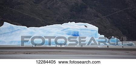 People in front of iceberg in Lago Grey, Torres del Paine National Park; Magallanes Region, Chile View Large Photo Image Stock Photography - People in front of iceberg in Lago Grey, Torres del Paine National Park; Magallanes Region, Chile. Fotosearch