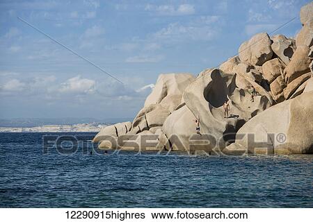 People jumping from the rocks in Valle della Luna; Santa Teresa, Sardinia, Italy View Large Photo Image Stock Photograph - People jumping from the rocks in Valle della Luna; Santa Teresa, Sardinia, Italy. Fotosearch