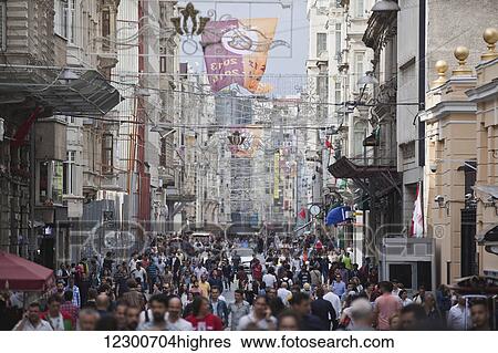 Stock Photograph - People shopping on Istiklal shopping street; Istanbul, Turkey. Fotosearch
