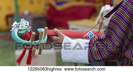 Stock Photograph - Person at Sangchen Choeker Buddhist Institute; Paro, Bhutan. Fotosearch