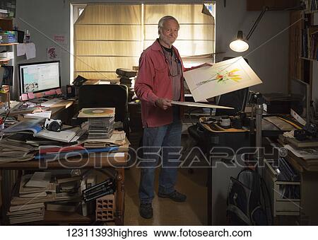 Stock Photograph - Photographer, Ken Welsh, in his studio; Torremolinos, Malaga, Andalusia, Spain. Fotosearch