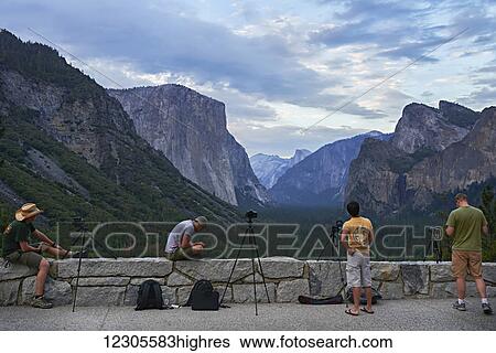 Photographers waiting to shoot Tunnel View at sunset, Yosemite Valley, Yosemite National Park; California, United States of America View Large Photo Image Stock Photograph - Photographers waiting to shoot Tunnel View at sunset, Yosemite Valley, Yosemite National Park; California, United States of America. Fotosearch