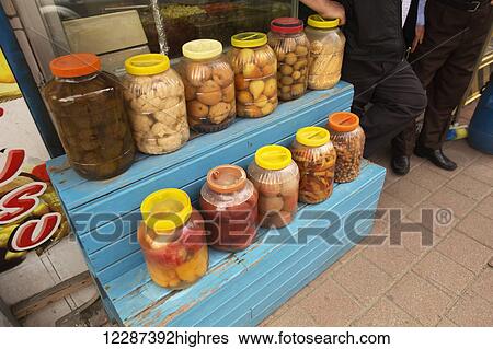Stock Photograph - Pickeled foods displayed outside of a store in the Balat and Fener area; Istanbul, Turkey. Fotosearch