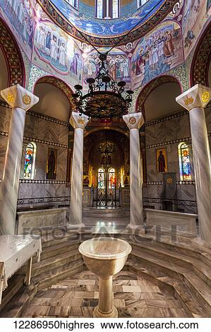 Stock Photograph - Pillars and colourful painted walls inside a church; Philippi, Greece. Fotosearch