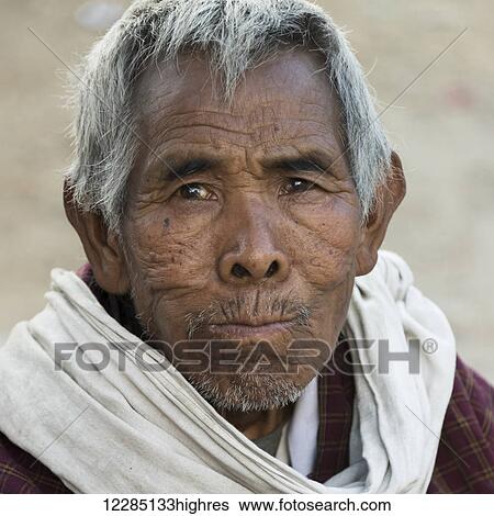 Stock Photograph - Portrait of a man with grey hair; Paro, Bhutan. Fotosearch
