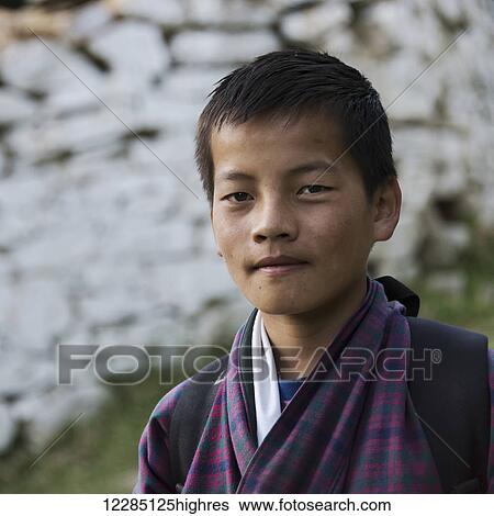 Stock Photograph - Portrait of a teenage boy; Paro, Bhutan. Fotosearch