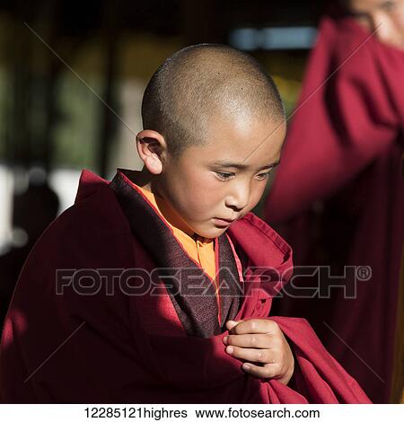 Stock Photograph - Portrait of a young monk; Bhutan. Fotosearch