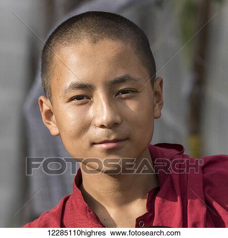 Stock Photograph - Portrait of a young monk; Punakha, Bhutan. Fotosearch