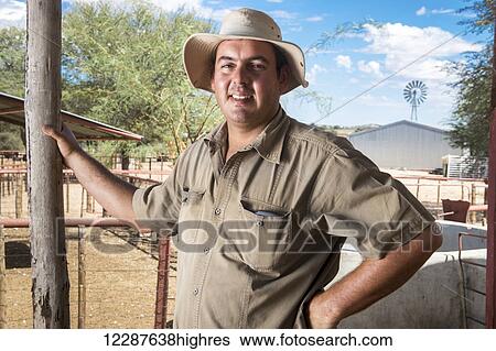 Stock Photograph - Portrait of sheep and game farmer; Koes, Namibia. Fotosearch