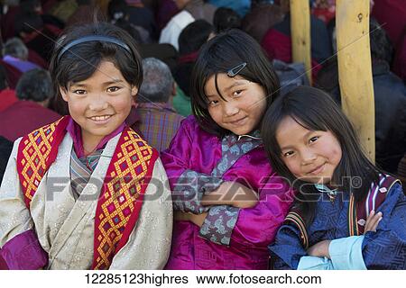 Stock Photograph - Portrait of three young girls; Paro, Bhutan. Fotosearch
