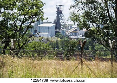 Premier diamond mine behind barbed wire fence; Cullinan, Gauteng, South Africa View Large Photo Image Stock Photo - Premier diamond mine behind barbed wire fence; Cullinan, Gauteng, South Africa. Fotosearch
