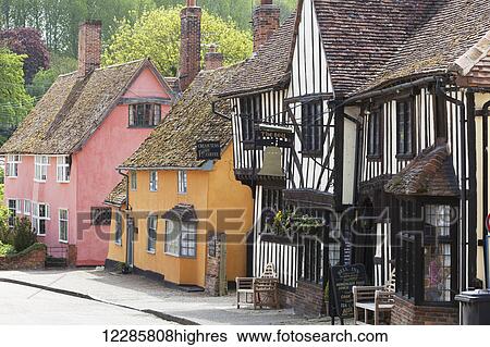 Stock Photograph - Quaint colourful and half-timbered houses in an English village; Kersey, Suffolk, England. Fotosearch