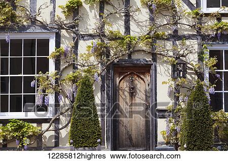 Stock Photograph - Quaint half-timbered house in an English village; Lavenham, Suffolk, England. Fotosearch