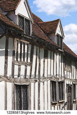 Quaint half-timbered house in an English village; Lavenham, Suffolk, England View Large Photo Image Stock Photograph - Quaint half-timbered house in an English village; Lavenham, Suffolk, England. Fotosearch