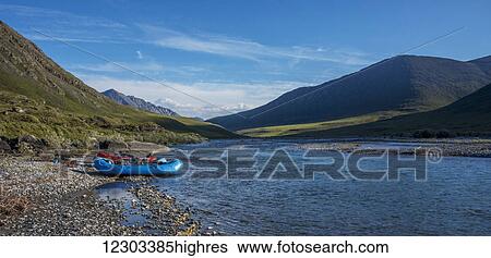 Stock Photograph - Rafts along the shore on the Marsh Fork of the Canning River in the Arctic National Wildlife Refuge, Summer, Alaska. Fotosearch