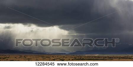 Rain clouds over Seno Ultima Esperanza and Cerro Monumento Morre near Puerto Natales; Magallanes region, Chile View Large Photo Image Stock Photography - Rain clouds over Seno Ultima Esperanza and Cerro Monumento Morre near Puerto Natales; Magallanes region, Chile. Fotosearch