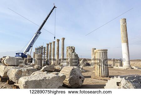 Stock Photograph - Rebuilding of Laodicea which has gone on for years, with spectacular ruins to visit; Laodicea, Turkey. Fotosearch