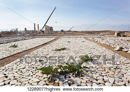 Stock Photograph - Rebuilding of Laodicea which has gone on for years, with spectacular ruins to visit; Laodicea, Turkey. Fotosearch