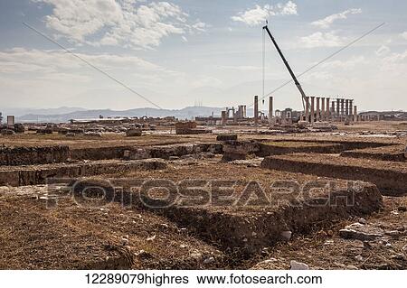 Stock Photograph - Rebuilding of Laodicea which has gone on for years, with spectacular ruins to visit; Laodicea, Turkey. Fotosearch