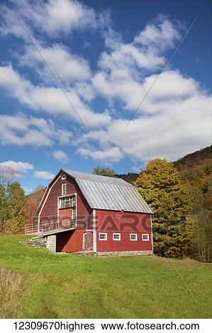Red barn with blue sky along route 100 in autumn; Hancock, Vermont, United States of America View Large Photo Image Stock Photograph - Red barn with blue sky along route 100 in autumn; Hancock, Vermont, United States of America. Fotosearch
