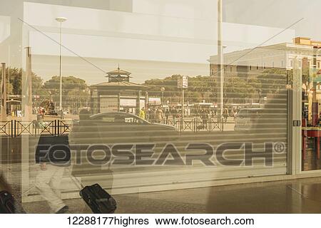 Reflection of cars and pedestrians in a window at the train station; Rome, Lazio, Italy View Large Photo Image Stock Photograph - Reflection of cars and pedestrians in a window at the train station; Rome, Lazio, Italy. Fotosearch