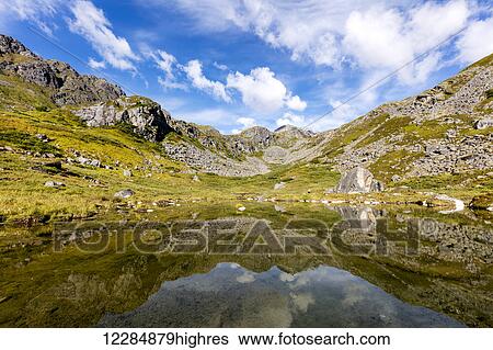Reflection of the Talkeetna Mountains in a beaver pond near Reed Lakes Trail in Hatcher Pass In Southcentral Alaska, summer View Large Photo Image Stock Photograph - Reflection of the Talkeetna Mountains in a beaver pond near Reed Lakes Trail in Hatcher Pass In Southcentral Alaska, summer. Fotosearch
